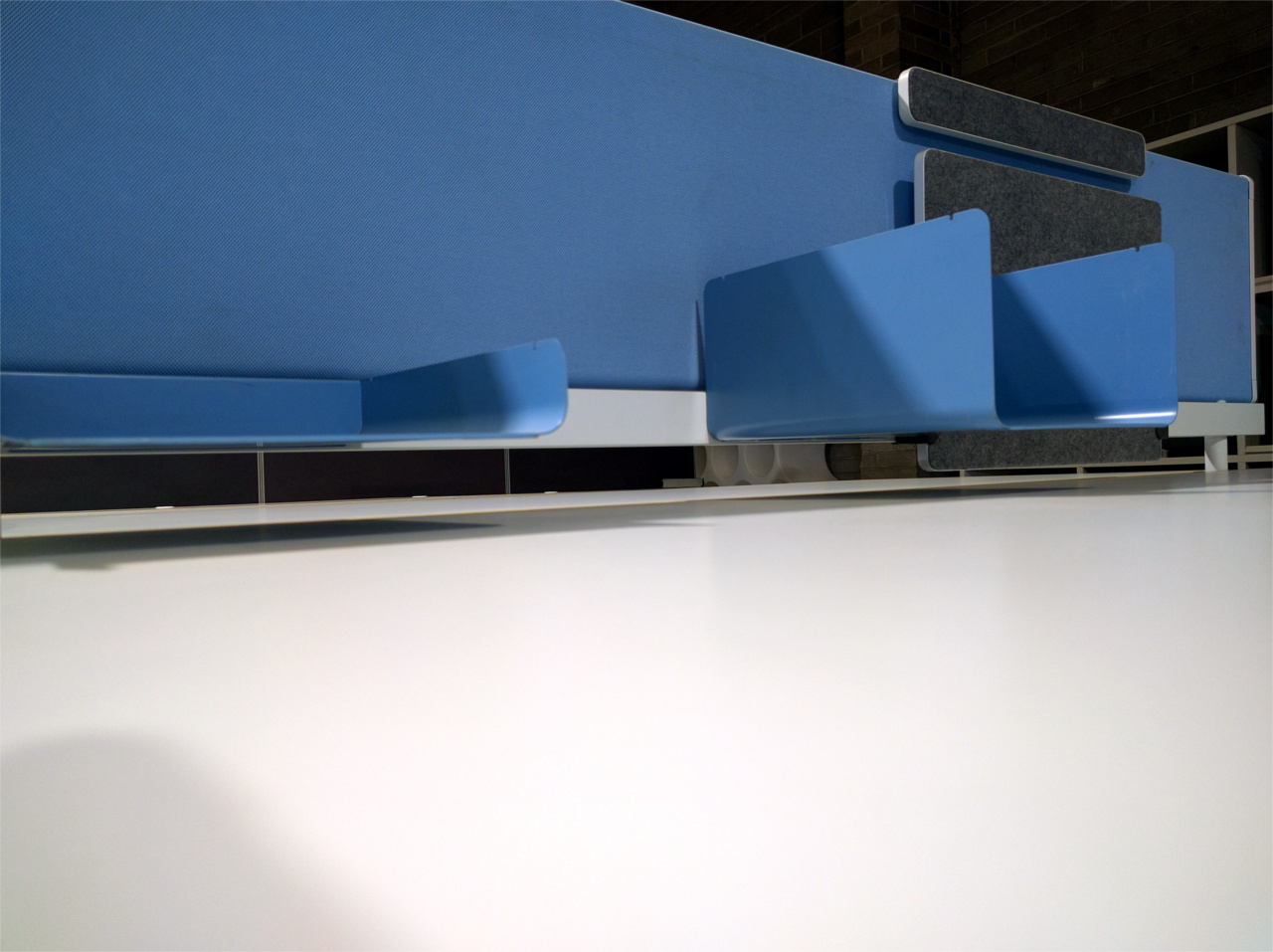 Blue workstation screen with shelving