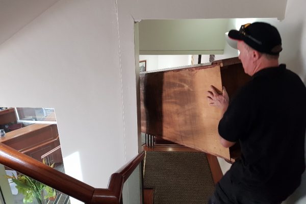Moving furniture down the stairs